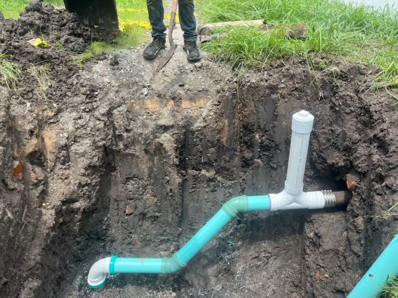 New PVC wye and cleanout tied into an existing buried drain line